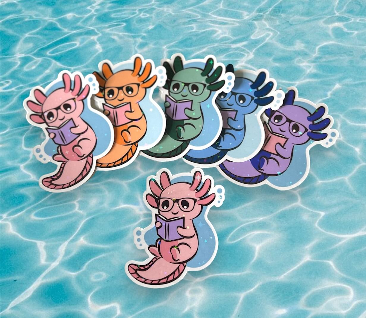 image of 6 stickers with a cute axelotl with classes reading a book in different colors